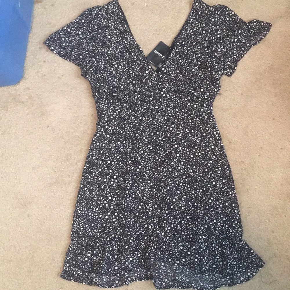 Ruched black and white print ruffled mini dress